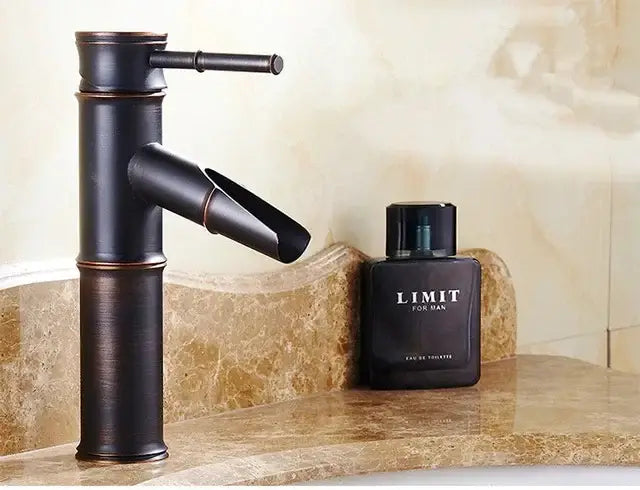 Bronze bamboo-style high arch mixer faucet with matte finish and modern waterfall design for bathroom use