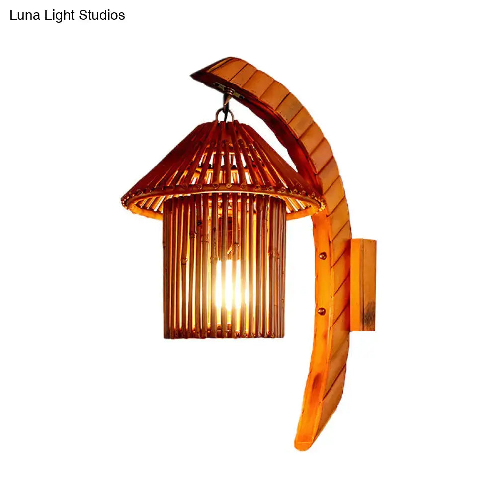 Warm-toned bamboo wall light fixture with curved leaf arm and pagoda lantern shade for bedroom wall light