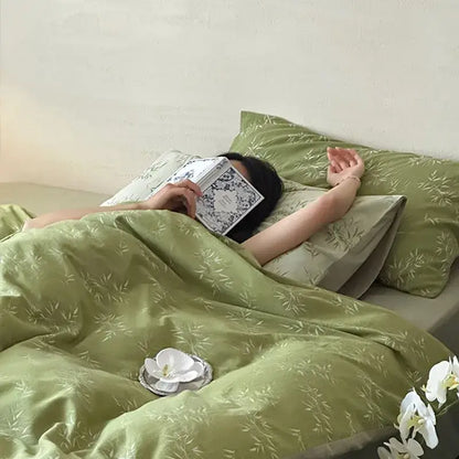 Olive green bamboo leaf jacquard cotton bedding set with matching pillows and white orchid decor for bedroom quilt set