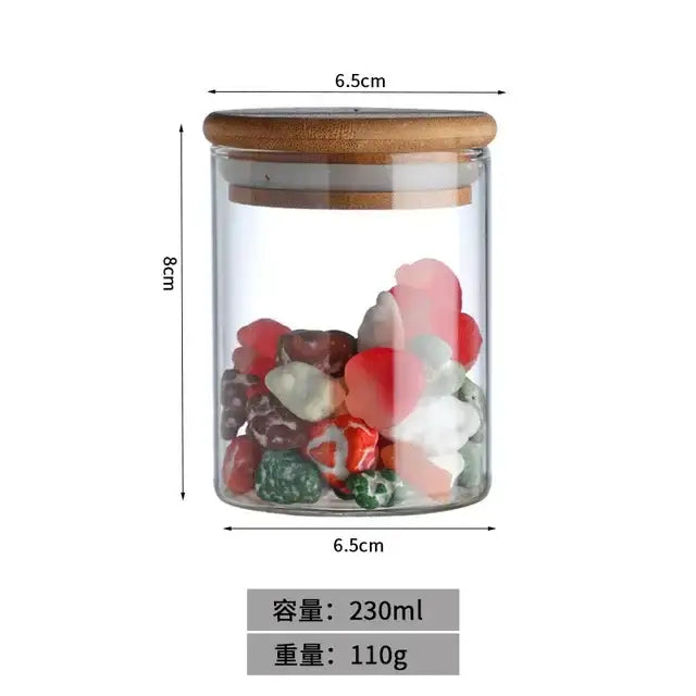 Clear glass food storage jar with bamboo lid filled with colorful heart-shaped stones for kitchen use