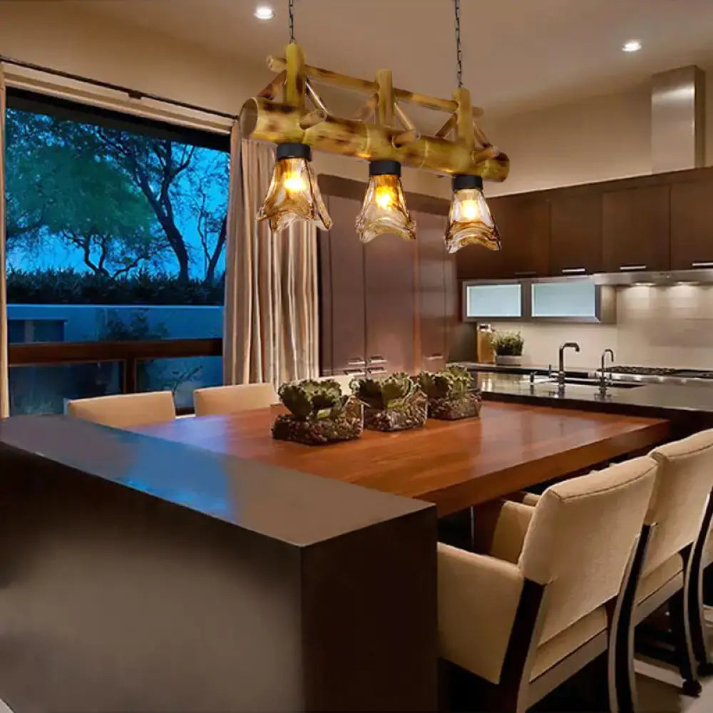 Rustic bamboo pendant light with two amber glass shades by DecorBites for warm island lighting ambiance