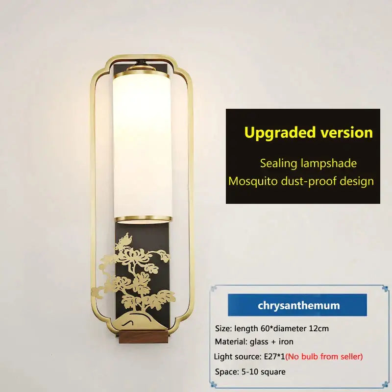Gold framed wall lamp with frosted glass and gold leaf chrysanthemum design on black panel from decorbites iron glass wall collection