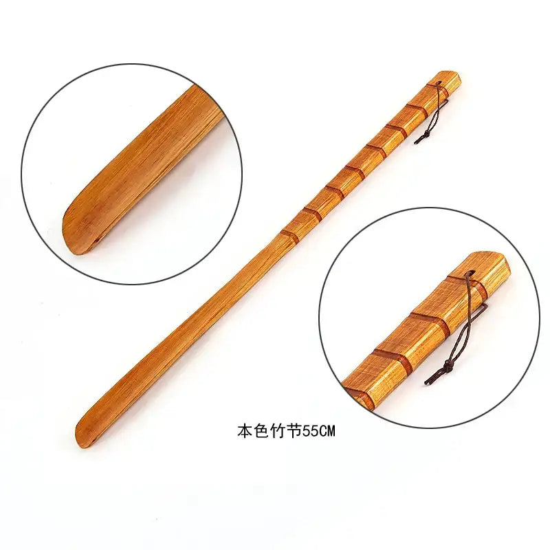 A 55cm natural bamboo pattern long handle shoe lifter with smooth light brown finish and segmented design