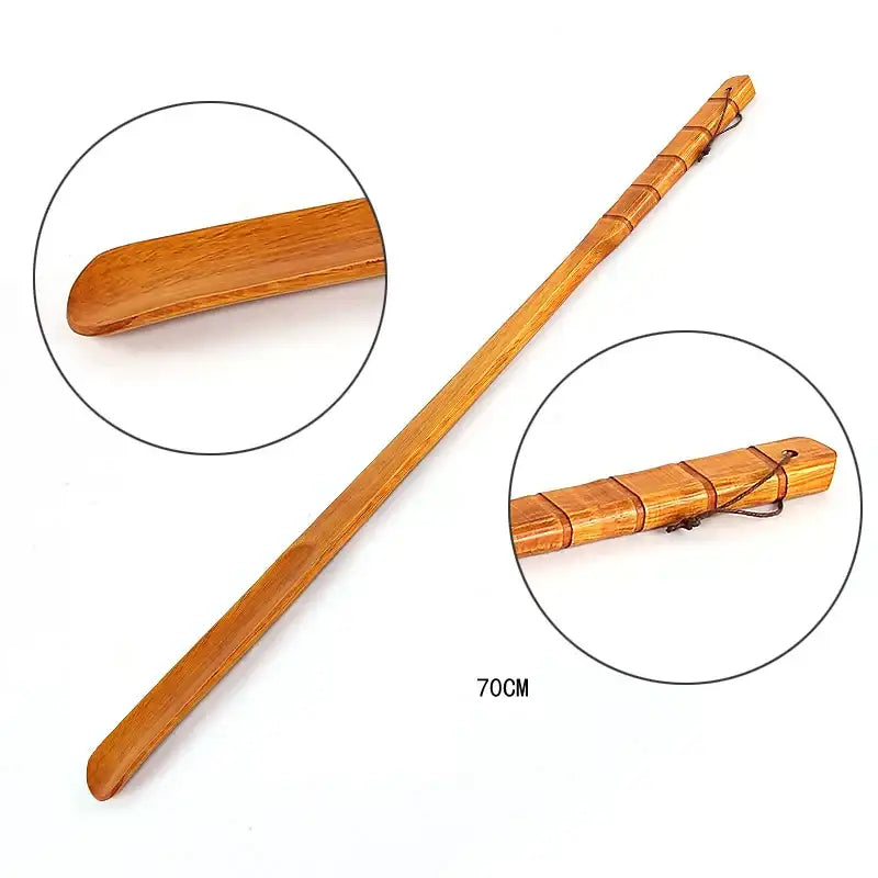 Bamboo pattern long handle shoe lifter made of smooth light brown wood with segmented handle and dark cord tie for dressing aid