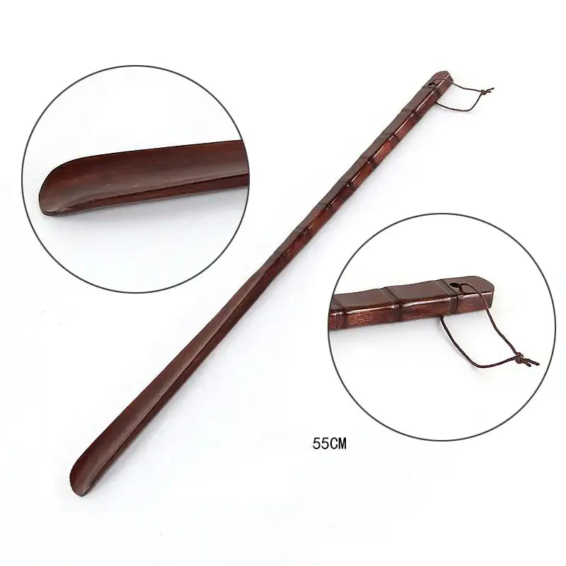 A polished dark brown wooden shoe lifter with bamboo pattern long handle for bedroom dressing aid and easy insertion