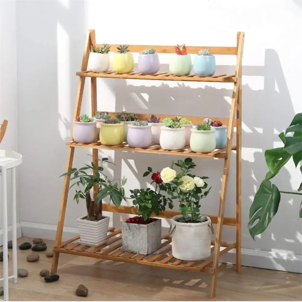Light brown bamboo decorbites 3 tier shelf stand with colorful ceramic pots on each plant pot shelf
