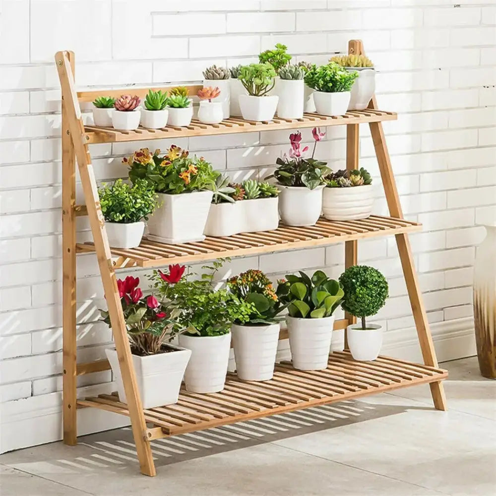 DecorBites™ bamboo light brown a-frame shelf stand with three slatted tiers holding white ceramic plant pot shelf