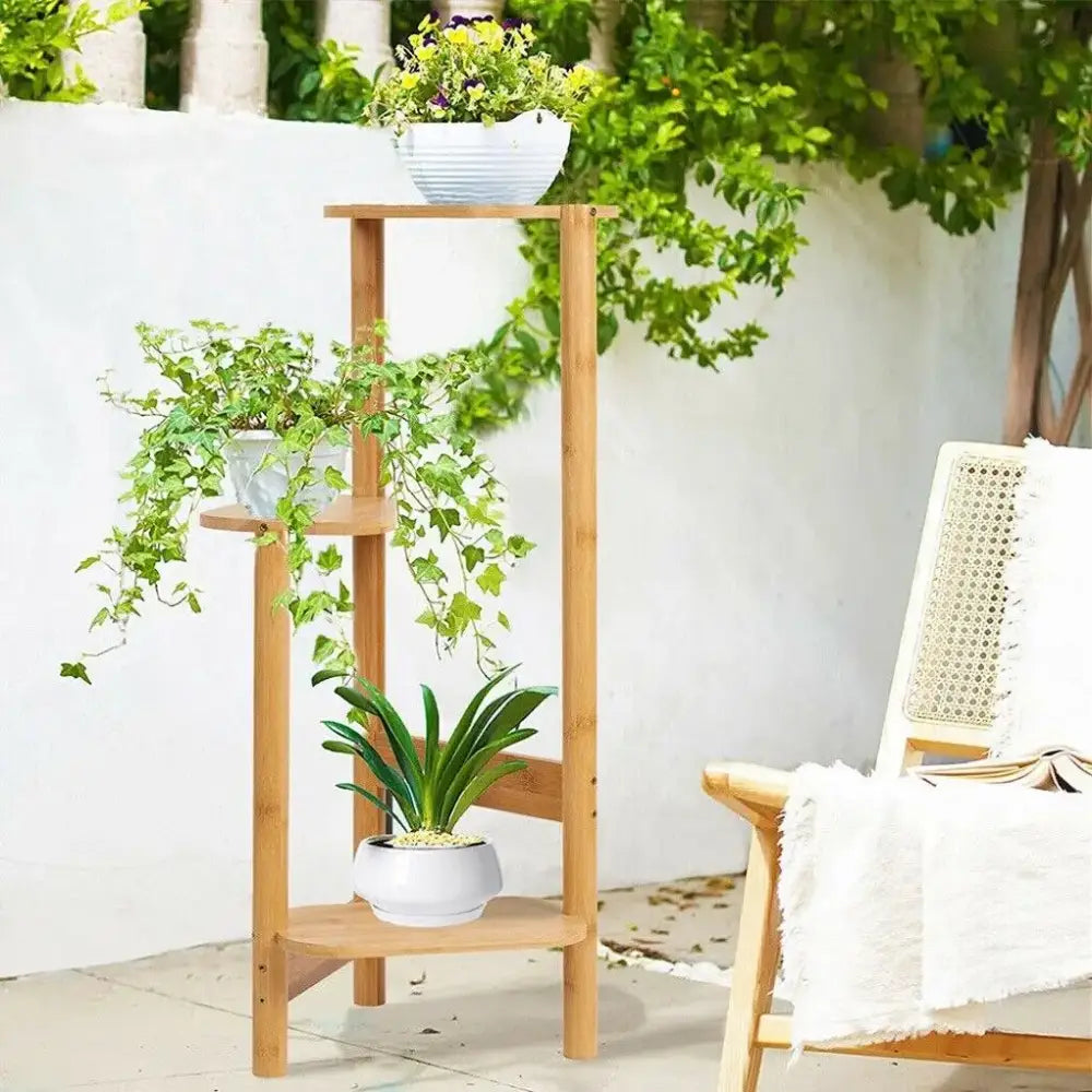 Light brown bamboo corner plant stand with three tiered shelves for flower display by decorbites