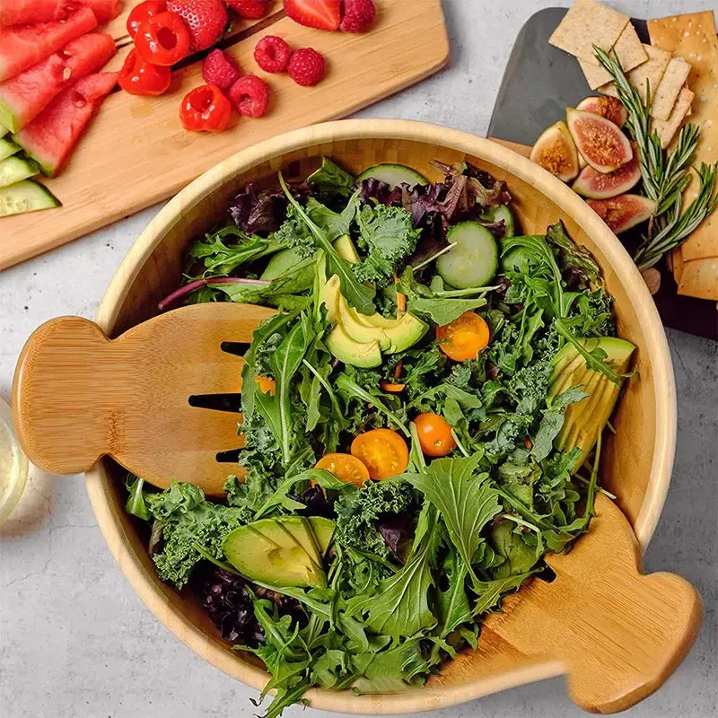 Light brown bamboo salad hands and spoon set featuring fish shaped wooden utensils by decorbites bamboo salad