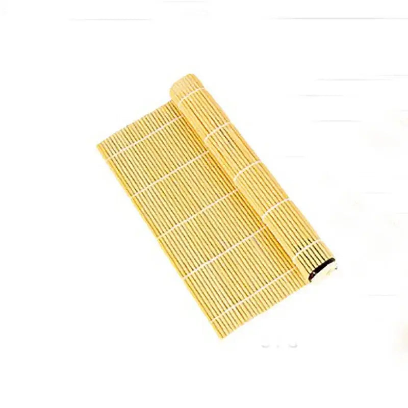 A light golden bamboo sushi rolling mat with woven texture and white binding strips for sushi rolling and onigiri rice paddles
