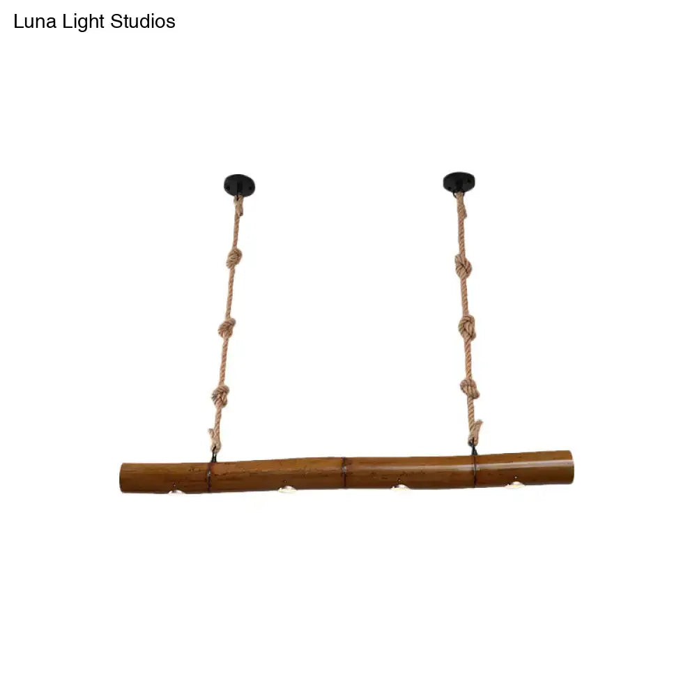 Decorbites™ bamboo tube island pendant light with yellow and brown bamboo, two braided rope suspensions, and black mounts