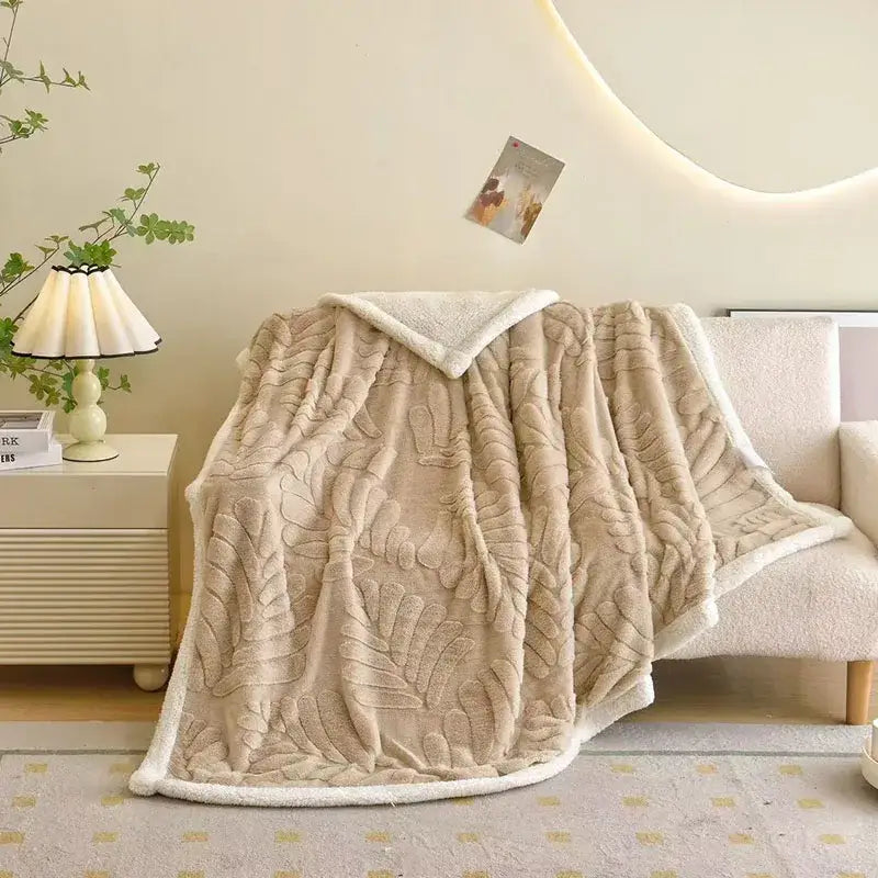 Beige banana leaf jacquard faux rabbit fur throw blanket with raised leaf jacquard pattern and soft white fleece lining