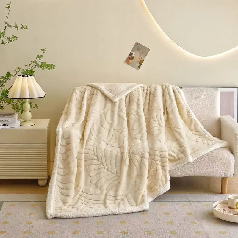 Cream-colored faux rabbit fur bedroom throw blanket with banana leaf jacquard raised leaf pattern texture