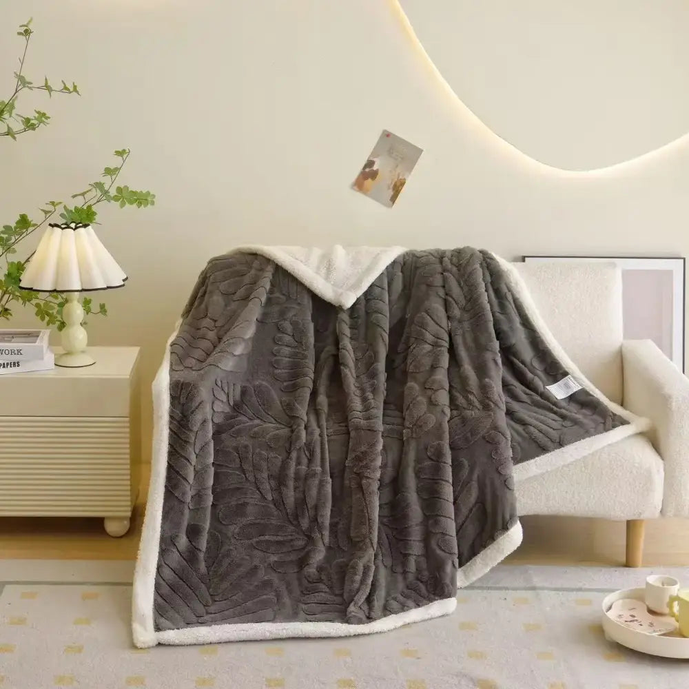 Banana leaf jacquard faux rabbit fur bedroom throw blanket in gray with raised leaf jacquard pattern and white sherpa lining