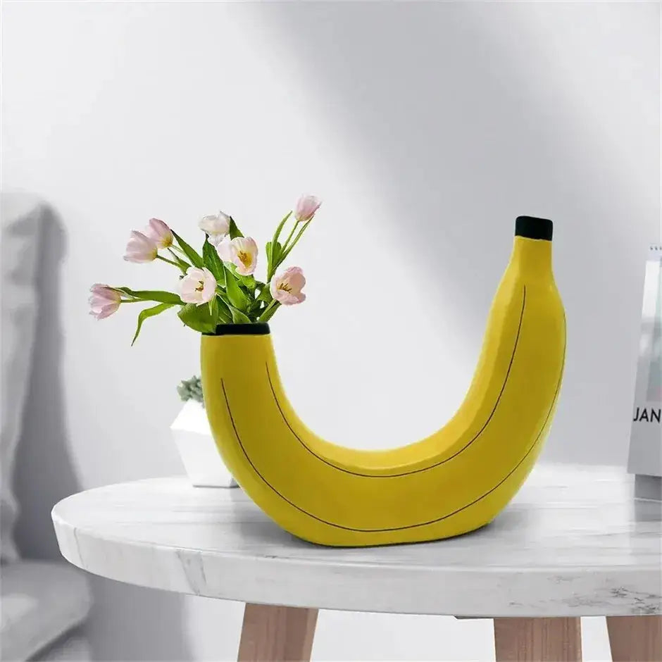 Bright yellow banana shape resin flower vase with black accents and a smooth glossy finish for home decor