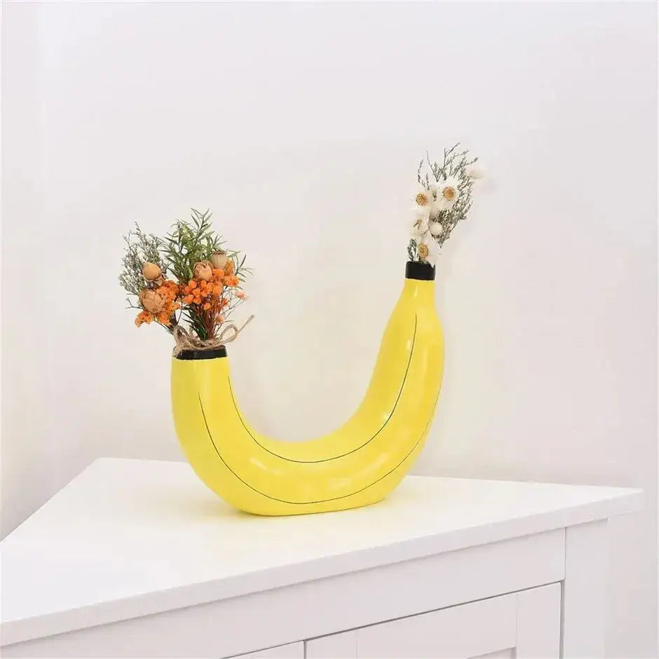 Bright yellow banana shape resin flower vase with black accents designed for decorative use