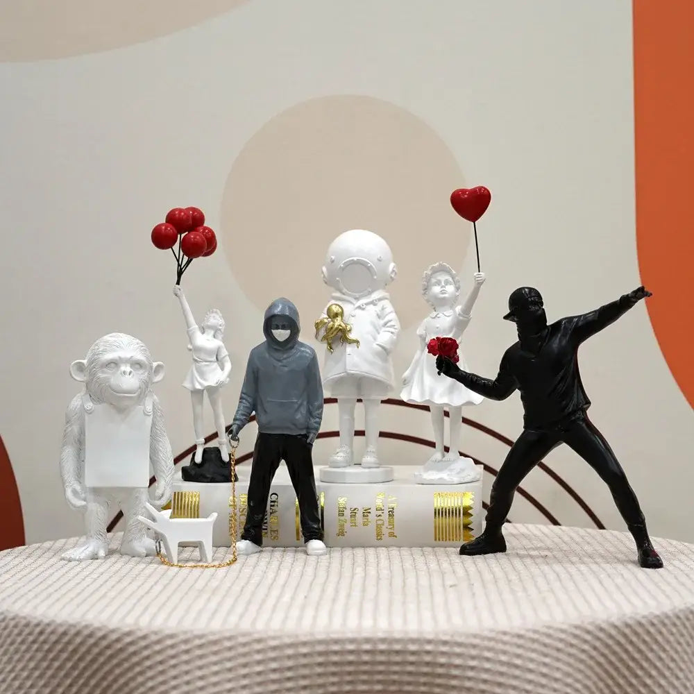 Black figurine from banksy sculpture collection holding red roses wearing cap for living room decor