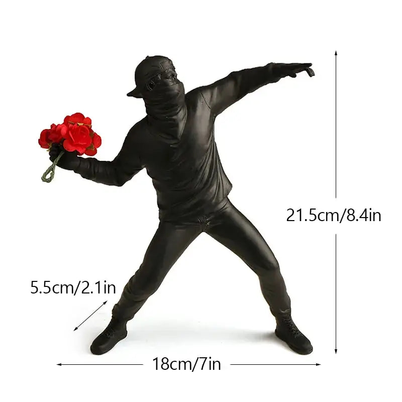 Black plastic figurine in full-body suit holding red roses from banksy sculpture collection for living room decor