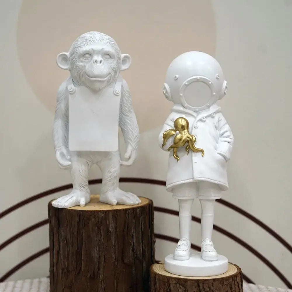 White resin Banksy sculpture collection figurine of child astronaut holding golden octopus for living room decor