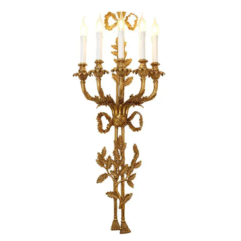 Golden baroque antique brass leaf wall sconce with five candle-style lights and ribbon decor for dining room by decorbites