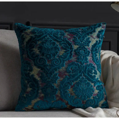 Teal velvet cushion with intricate gold and burgundy embroidery featured in decorbites damask cut velvet cushion covers