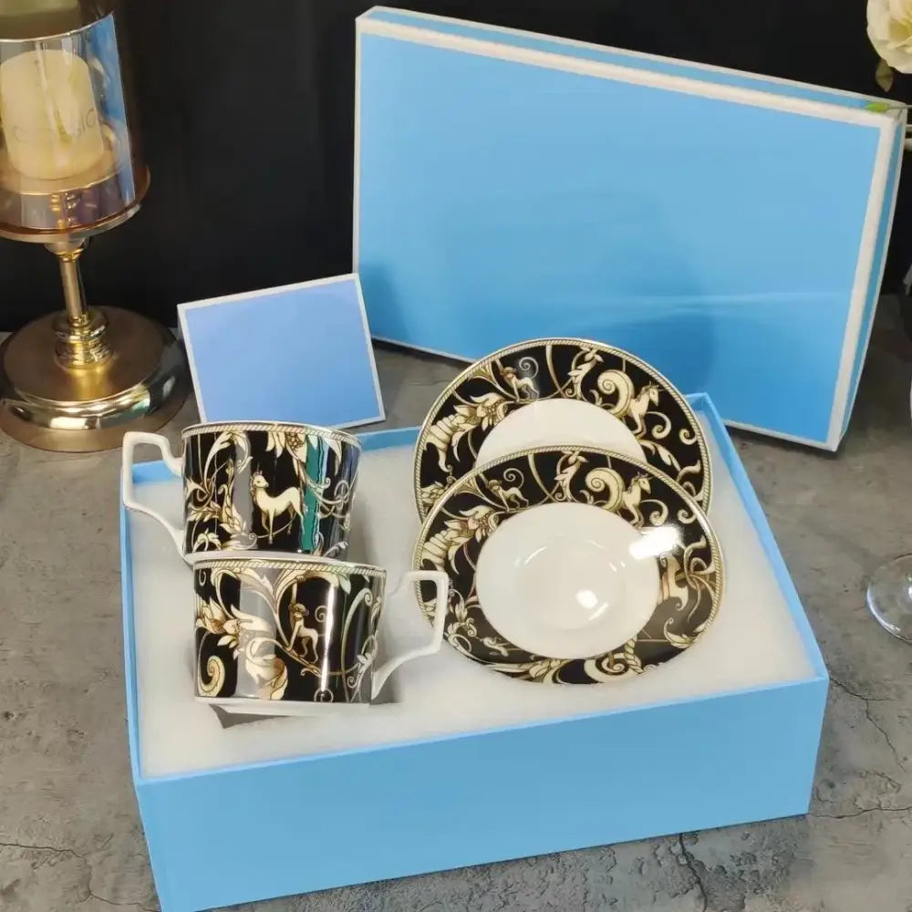 Elegant black and gold porcelain tea set with deer patterns in a light blue box from the black unicorn series kitchenware