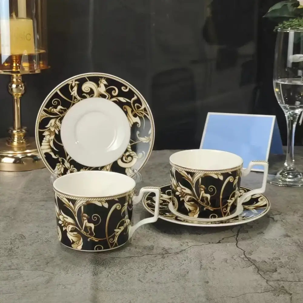 Elegant black and gold porcelain coffee cups with baroque patterns and saucers from the black unicorn series kitchenware