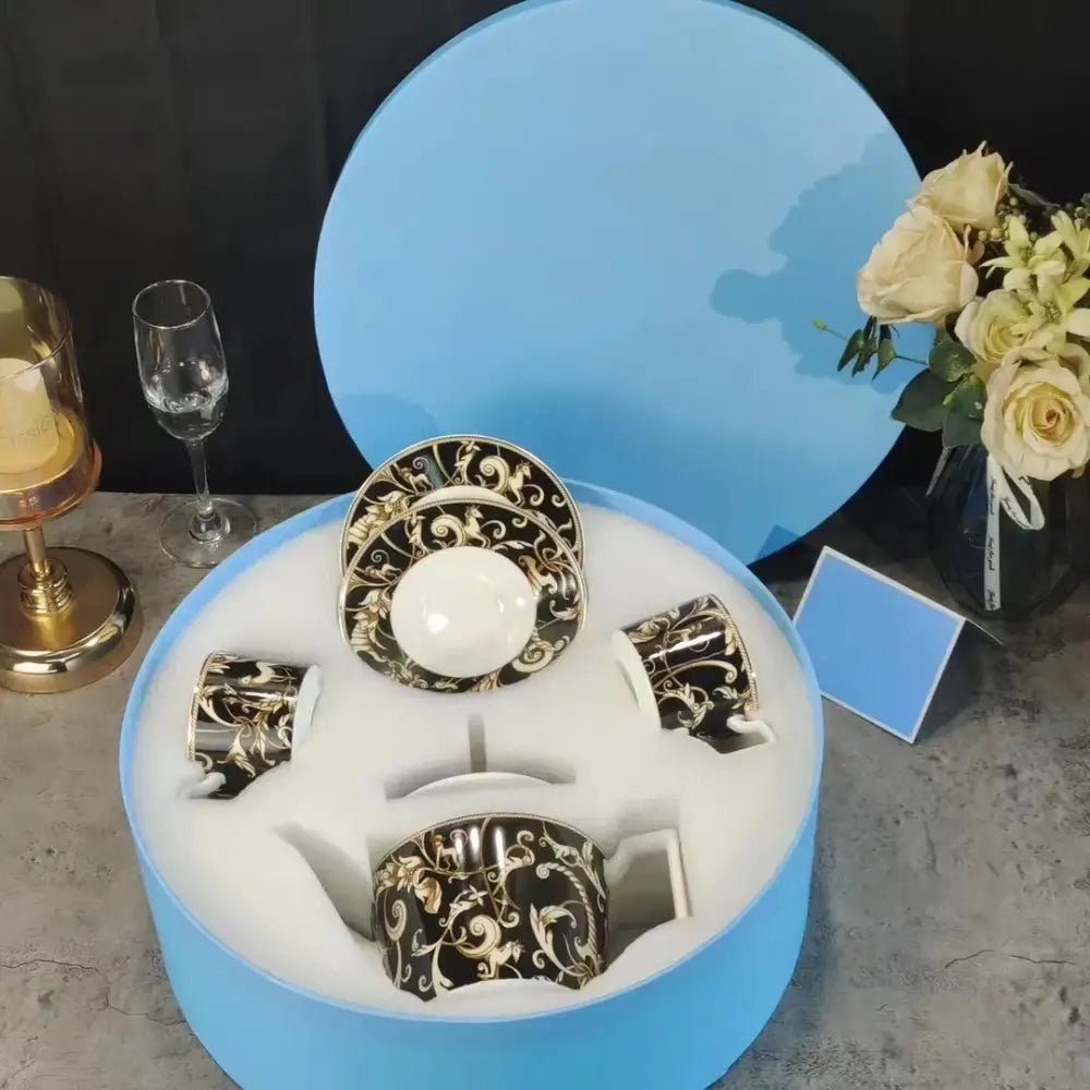 Elegant black and gold ornate porcelain coffee set in a light blue box from the black unicorn series kitchenware collection