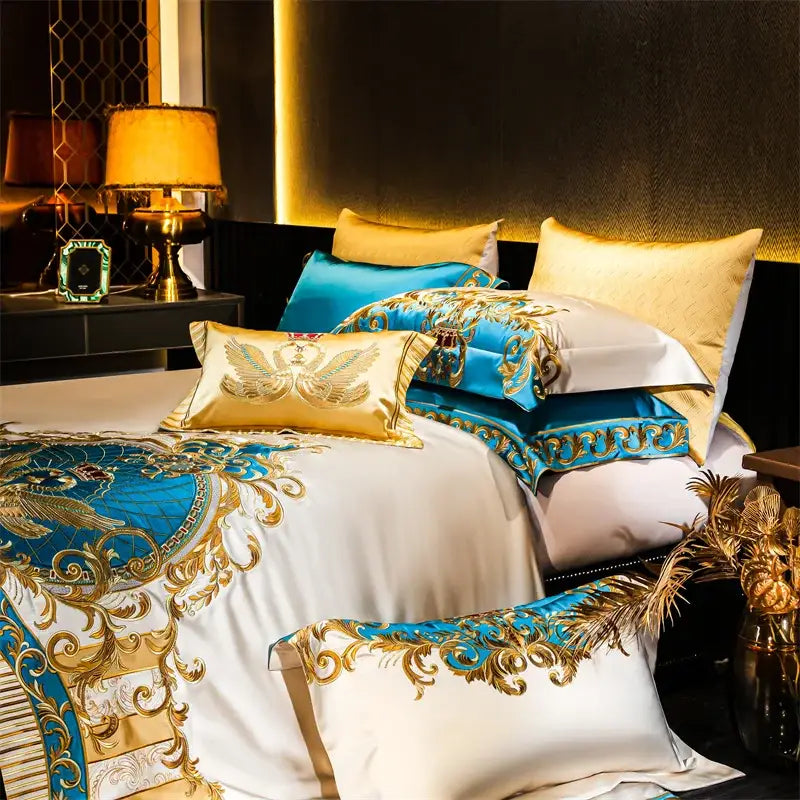 Luxurious cotton bedding set with gold and turquoise baroque embroidery on white, blue, and cream linens