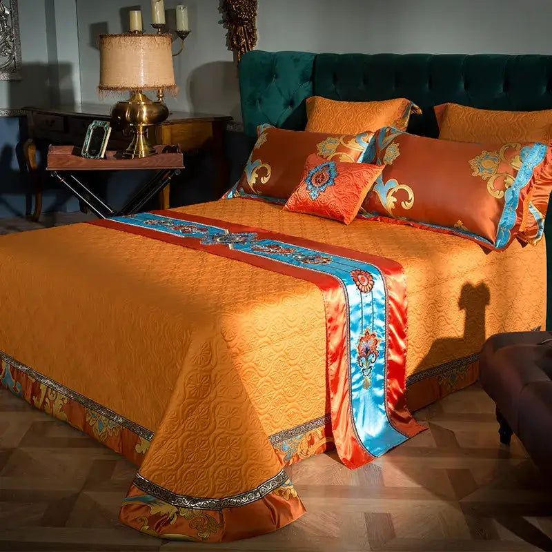 Orchid-colored satin bedding set with intricate gold and blue embroidery cotton patterns on border for bedroom use