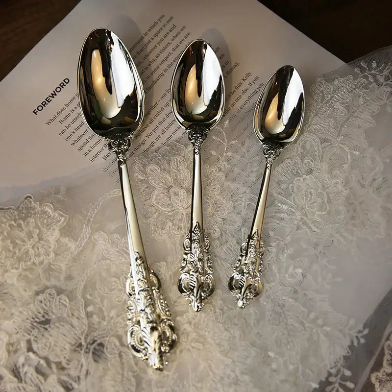 Set of three ornate silver-toned spoons with intricate floral and scrollwork handles from decorbites baroque silver cutlery set