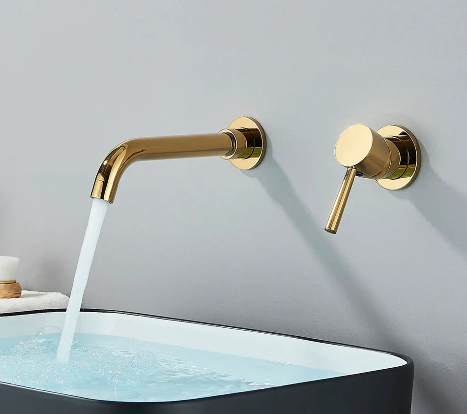 Gold-toned basin faucet wall mounted bathroom faucet with brushed brass finish and hot water control handle