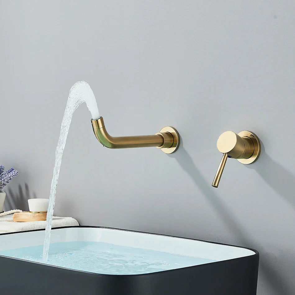 Modern gold-toned basin faucet wall mounted with brushed brass finish and minimalist cold hot water control handle