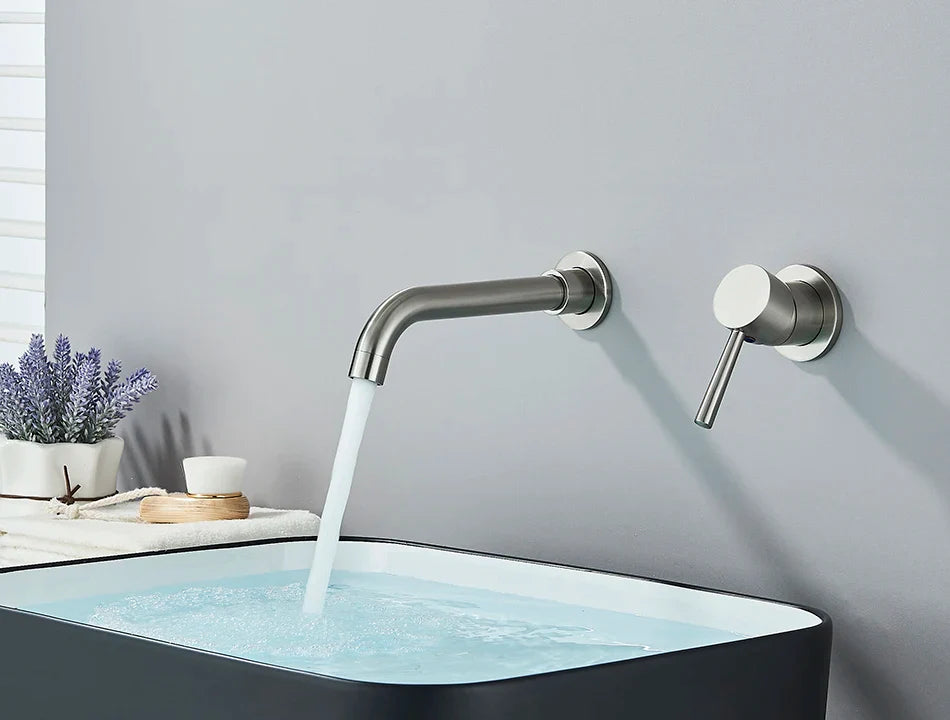 Modern brushed stainless steel basin faucet wall mounted with sleek curved spout and separate hot water control handle