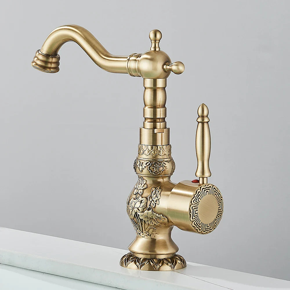 Antique brass single hole basin faucet with ornate floral and geometric embossing for bathroom vessel sinks