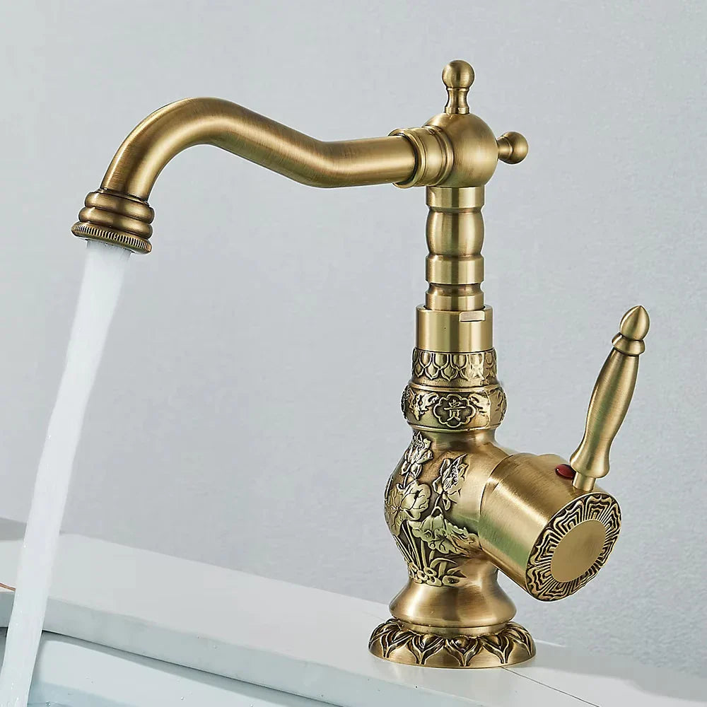 Antique brass single handle basin faucet with ornate floral and geometric embossing for single hole bathroom sink