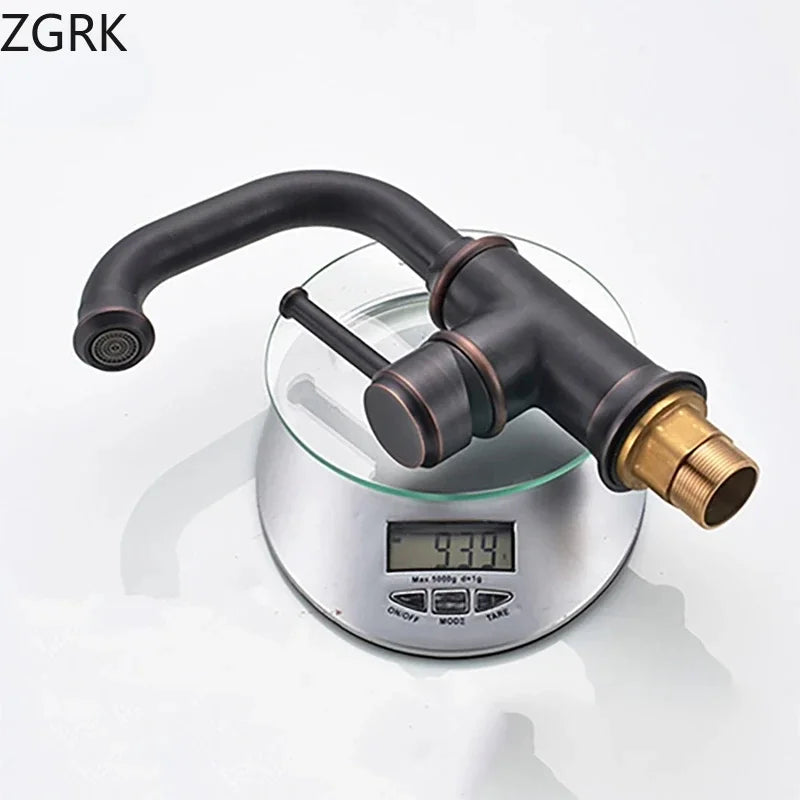 Black matte finish single hole basin faucet with brass accents and curved spout on digital scale for cold water use housing material