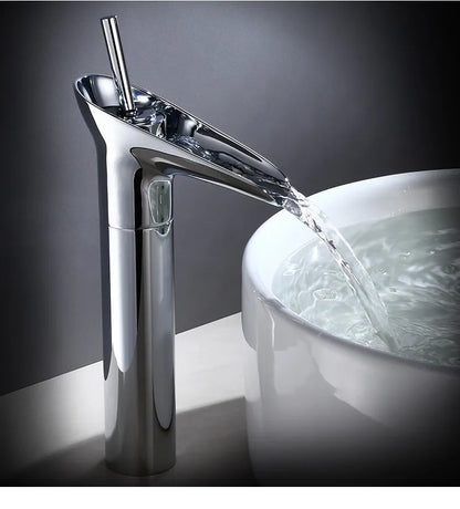 Bathroom faucet antique brass waterfall deck mounted with chrome finished waterfall spout and metered valve control flowing water into white ceramic sink