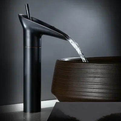 Black matte-finish waterfall bathroom faucet with deck mounted metered valve control and sleek modern design