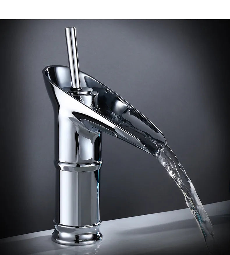 Chrome finished deck mounted bathroom faucet with bamboo inspired base and metered valve control for waterfall flow