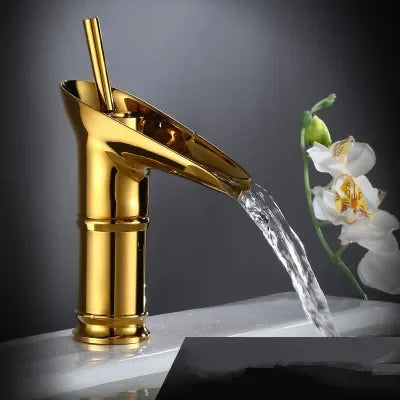 Golden bamboo-style bathroom faucet in antique brass with deck mounted metered valve control and polished finish