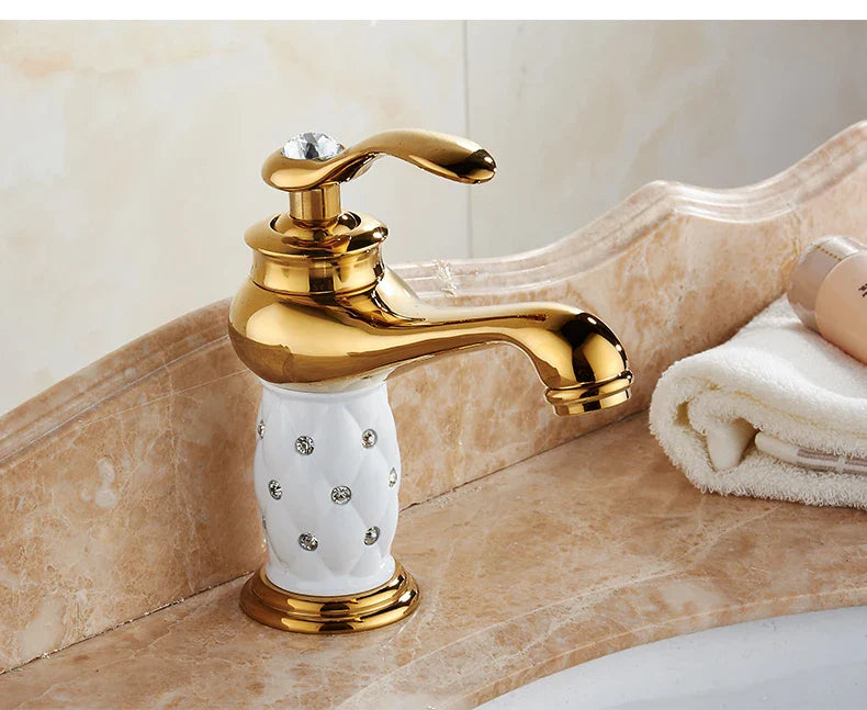 Bathroom faucet antique bronze finish with gold finish, white ceramic base, and crystal-embedded decorative handle