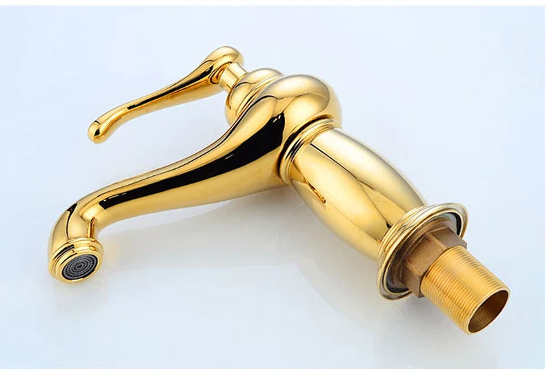 Golden brass finished single-handle bathroom faucet with curved spout and antique bronze finish for vintage style