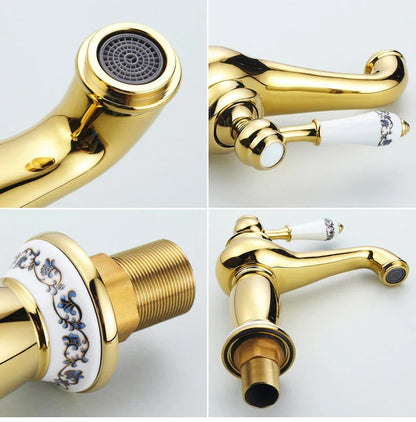 Gold-finished bathroom faucet with white ceramic handles and blue floral patterns in bronze finish