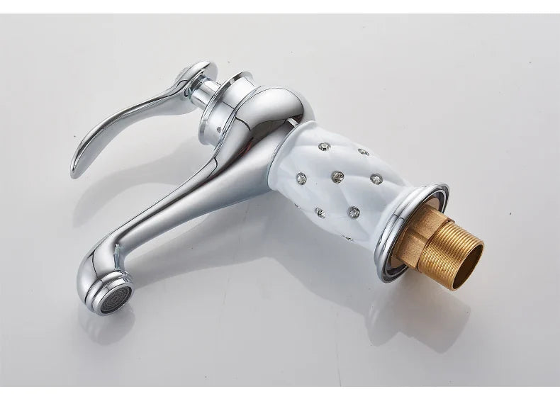 Bathroom faucet antique bronze finish with chrome body, white ceramic handle with crystals, and brass threaded base