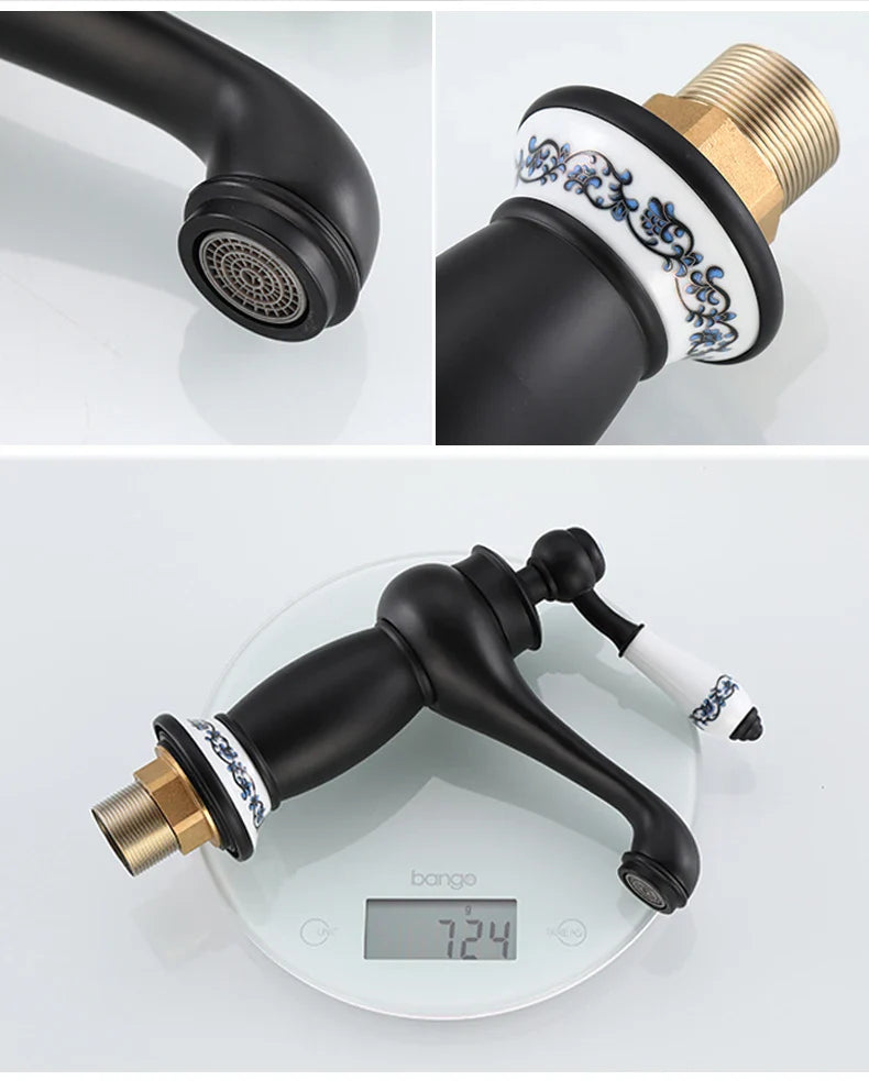 Black matte bathroom faucet with bronze finish and ornate blue and white ceramic accents on spout and handle