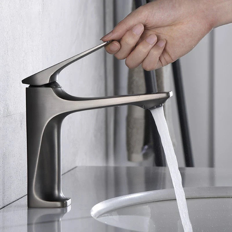 Modern brushed nickel single-handle bathroom faucet with brass core and sleek minimalist design for bathroom use