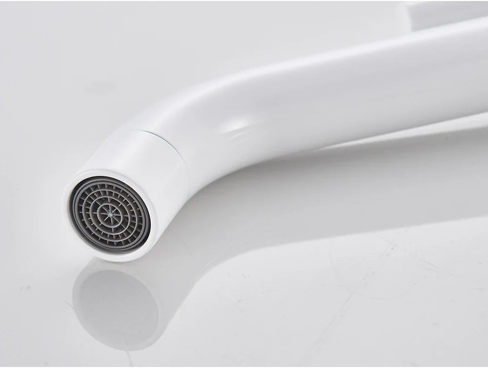 White curved bathroom faucet with sleek modern design and gray circular spray head in brushed gold mixer tap style