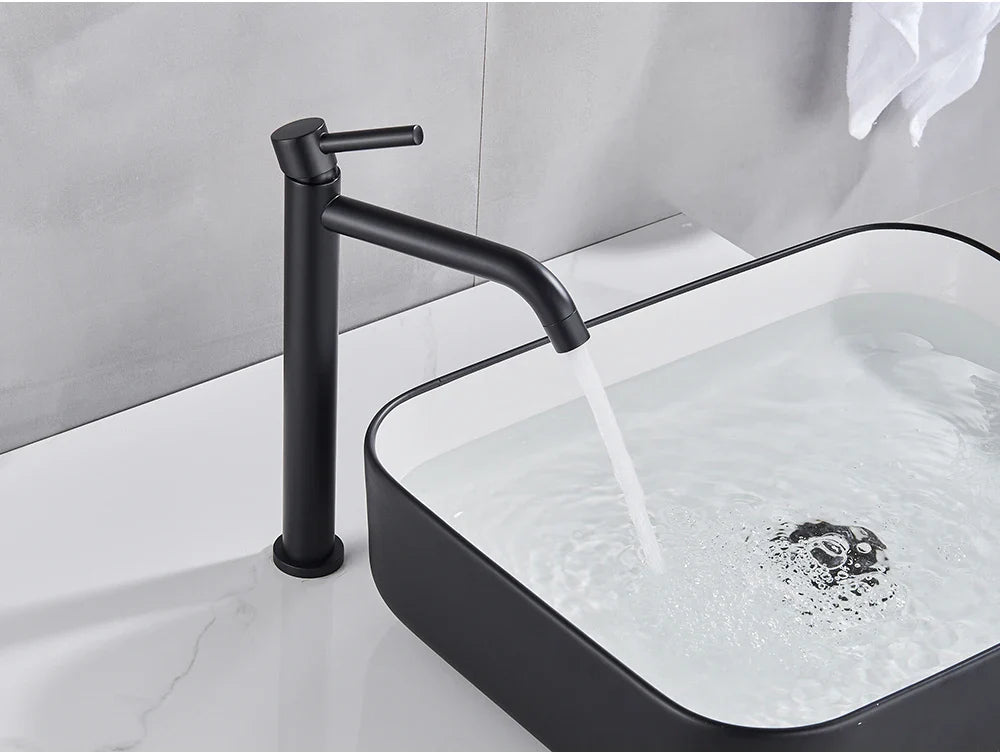 Black matte-finish modern bathroom faucet with brushed gold mixer tap and single lever handle in minimalist design