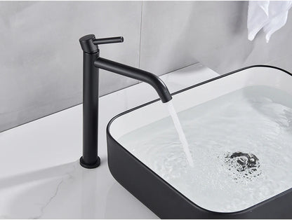 Black matte-finish modern bathroom faucet with brushed gold mixer tap and single lever handle in minimalist design
